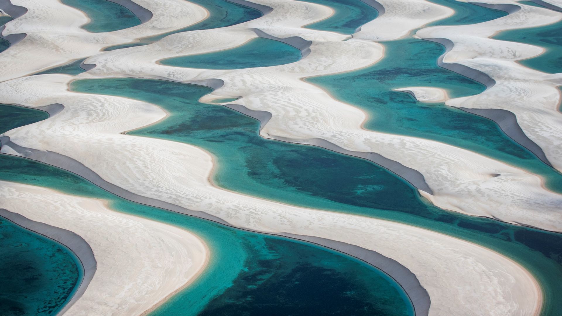 <p>                     Lençois Maranhenses National Park contains vast swathes of white dunes sweeping across the otherworldly landscape. According to the travel website Lonely Planet, from May to September rainwater fills the crystal-clear pools, which are offset by striking white dunes.                    </p>                                      <p>                     The enchanting dunescape stretches over 43 miles (70 km) along the coast and over 30 miles (50 km) inland. Lençois translates as "bedsheets" in Portuguese and refers to the rolling white dunes that dominate the landscape.                    </p>                                      <p>                     The national park is best visited in June, July and August, when the lagoons are at their best, according to Lonely Planet.                   </p>