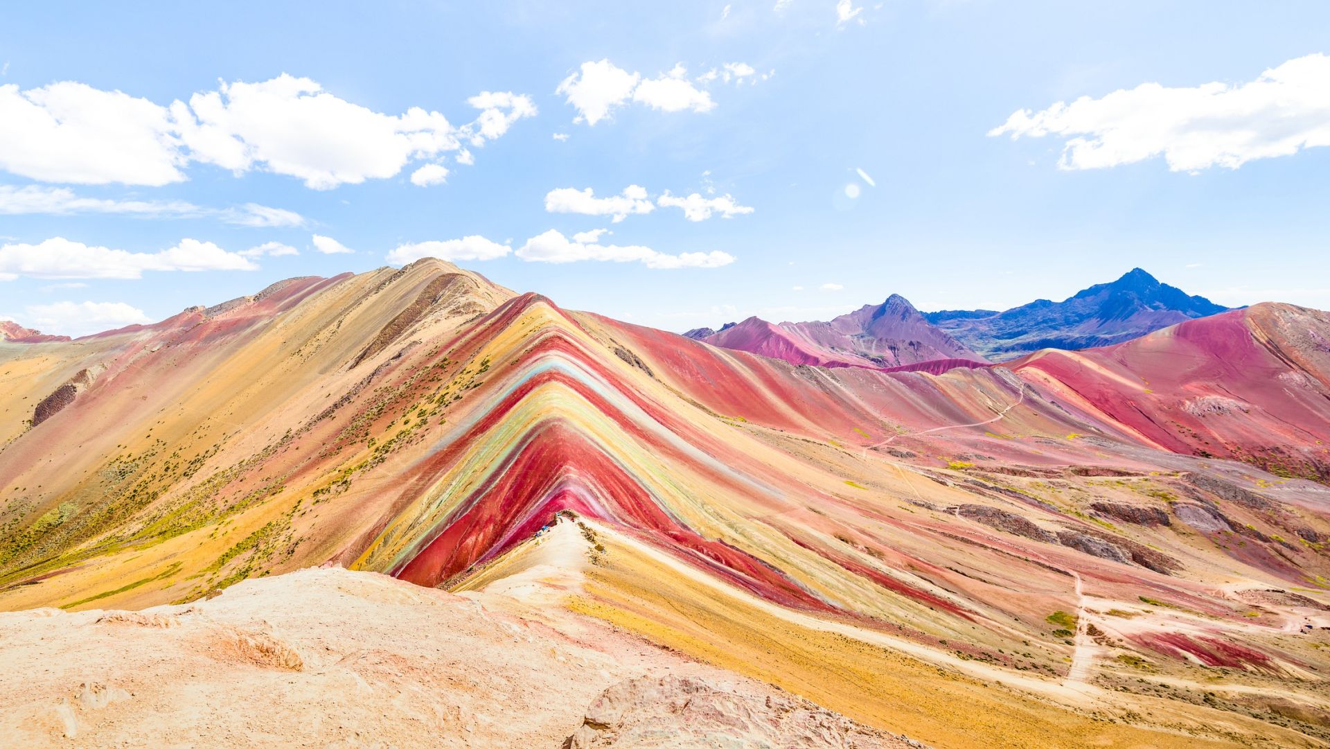 <p>                     Rainbow Mountain is located in the Andes Mountains of Peru, about 17,000 feet (5,200 m) above sea level, according to the Rainbow Mountain tourism website. The streaked mountain is famed for its technicolor appearance, which is created by different mineral sediments.                    </p>                                      <p>                     Until recently, this rainbow jewel of the Andes was undiscovered, hidden beneath a blanket of snow. As the snow melted, the hidden gem was revealed, and the area now attracts hundreds of visitors every day.                    </p>                                      <p>                     Rainbow Mountain is also known as Vinicunca, according to the official tourism website Rainbow Mountain Peru. The word Vinicunca originates from Quechua — an indigenous language of Peru — and translates to "colored mountain".                   </p>