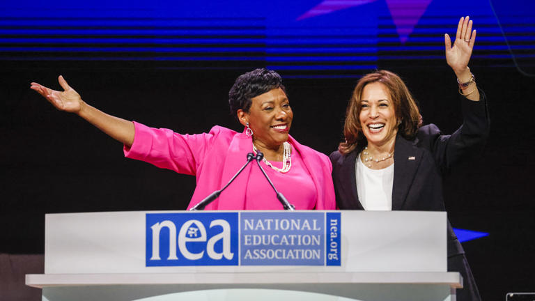 U.S. Vice President Kamala Harris, right, waves with Becky Pringle, president of the National Education Association, at the National Education Association 2022 annual meeting and representative assembly in Chicago July 5, 2022. Tannen Maury/EPA/Bloomberg via Getty Images