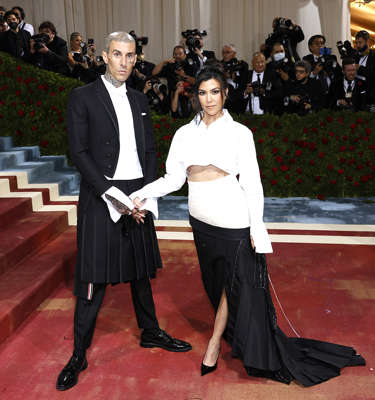2022 is on pace to be the most wedding-packed year in decades, and celebrities have totally embraced the trend. There have been so many high profile weddings this year, we had to round them up for you to see. One of the biggest unions was between Kourtney Kardashian and Travis Barker, seen here at the 2022 Met Gala. The couple whisked their family away to Italy in mid-May 2022 for a romantic ceremony totally designed by Dolce & Gabbana. The couple got a head-start on marriage the weekend before to get legally wed in Santa Barbara, California. And before that, they enjoyed an impromptu practice wedding in Las Vegas in April 2022. Want to learn more about 2022’s best celebrity weddings? Click through the gallery to see everyone in Hollywood who tied the knot.