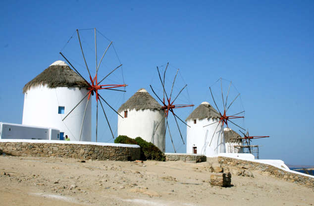 ÎÎ¹Î±ÏÎ¬Î½ÎµÎ¹Î± 25 Î±ÏÏ 42: This July 6, 2014 photo shows picturesque windmills on the island of Mykonos in the Cyclades, a Greek island chain in the Aegean Sea. The tradition of building windmills on the island dates back centuries. The Cyclades are known for panoramic views of the sea, homes tucked into cliffsides and waterfronts, black-sand beaches and dramatic sunsets.