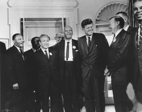 Slide 16 de 27: 28th August 1963: American president John F. Kennedy in the White House with leaders of the civil rights 'March on Washington' (left to right) Whitney Young, Dr Martin Luther King (1929 - 1968), Rabbi Joachim Prinz, A. Philip Randolph, President Kennedy, Walter Reuther (1907 - 1970) and Roy Wilkins. Behind Reuther is Vice-President Lyndon Johnson. (Photo by Three Lions/Getty Images)