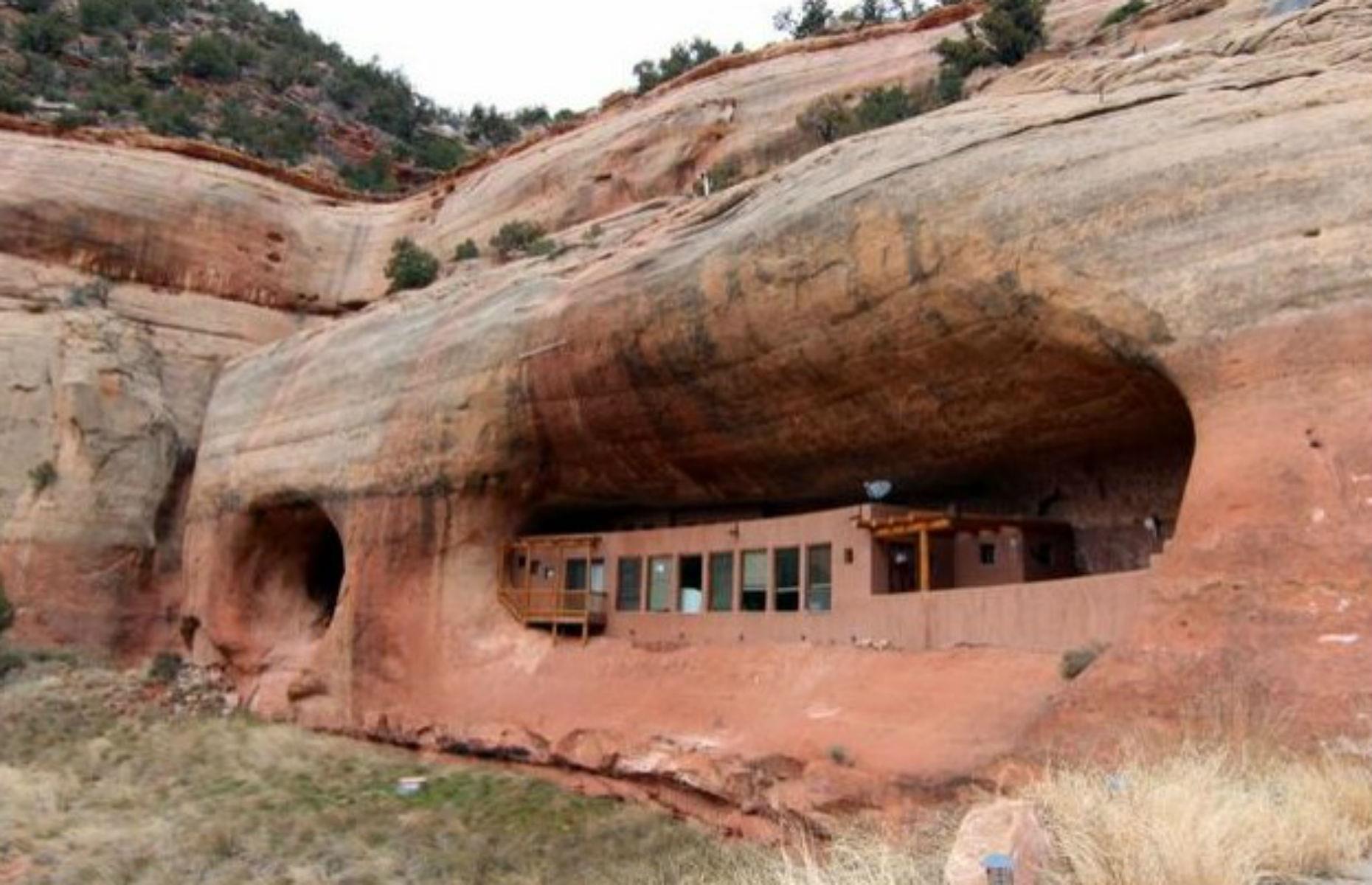 Slide 29 of 54: This historic-looking cave house is nestled in an alcove in south-estern Utah and is only 20 minutes from a local town, despite looking like it's in the middle of nowhere.