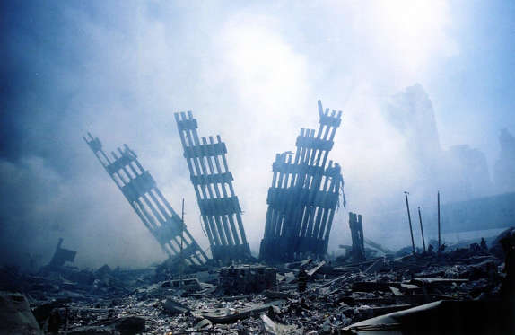 Slide 2 of 25: 10/10 US-ATTACKS-2ND YEAR ANNIVERSARY The rubble of the World Trade Center smoulders following a terrorist attack 11 September 2001 in New York. A hijacked plane crashed into and destroyed the landmark structure. The all-out war on terrorism unleashed by Washington after the attacks marked a turning point in US-Arab relations and nowhere more so than in once top ally Saudi Arabia. With 15 of the 19 suicide hijackers carrying Saudi nationality and mastermind Osama bin Laden being the scion of a leading Saudi family, the desert kingdom and world oil kingpin, suddenly found itself on the frontline of the war on terror prosecuted by US President George W. Bush. AFP PHOTO/Alex Fuchs (Photo credit should read ALEX FUCHS/AFP/Getty Images)