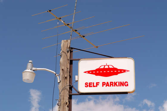 Slide 20 of 25: A parking sign for flying saucers at a gas station in the desert near the United States military installation known as Area 51. There have long been rumors of military secrets being tested at the location as well as extra terrestrial space craft, or UFOs, being sighted. (Photo by Christopher Morris/Corbis via Getty Images)