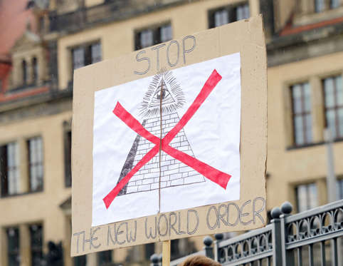 Slide 24 of 25: DRESDEN, GERMANY - JUNE 12: A protester's sign reads 'Stop The New World Order' near the venue of the 2016 Bilderberg Group conference on June 12, 2016 in Dresden, Germany. Dresden is hosting the Bilderberg gathering that will bring together 130 leading international players from politics, industry, finance, academia and media to discuss globally-relevant issues from June 9th to the 12th. A wide spectrum of groups have announced protests to be held nearby. Critics charge that the secretive nature of the Bilderberg Groups annual meetings is undemocratic. (Photo by Chad Buchanan/Getty Images)