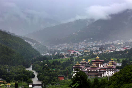 THIMPHU, BHUTAN - AUGUST 13: Tashichho dzong is seen in front of the main capital city Thimphu, Bhutan on Aug 13, 2014. It is the main secretariat building which houses the offices of the king. The central monastic body and some government ministries are