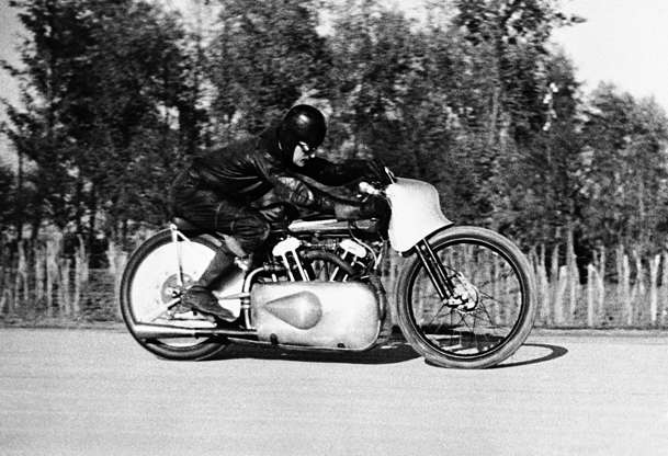 Slide 3 of 10: Eric Fernihough, the British racing motor cyclist, established two new world's speed records on the Gyon Road in Budapest, Hungary, on Nov. 9, 1936. On his 1,000 C.C. Brough Superior machine he averaged 164. 778 miles per hour as compared with the old record of 162.7 miles per hour. His other record was 80.964 miles per hour for the motor cycle-sidecar combination speed record. His first record was made with a flying start. Eric Fernihough at speed during his record breaking run at Budapest.