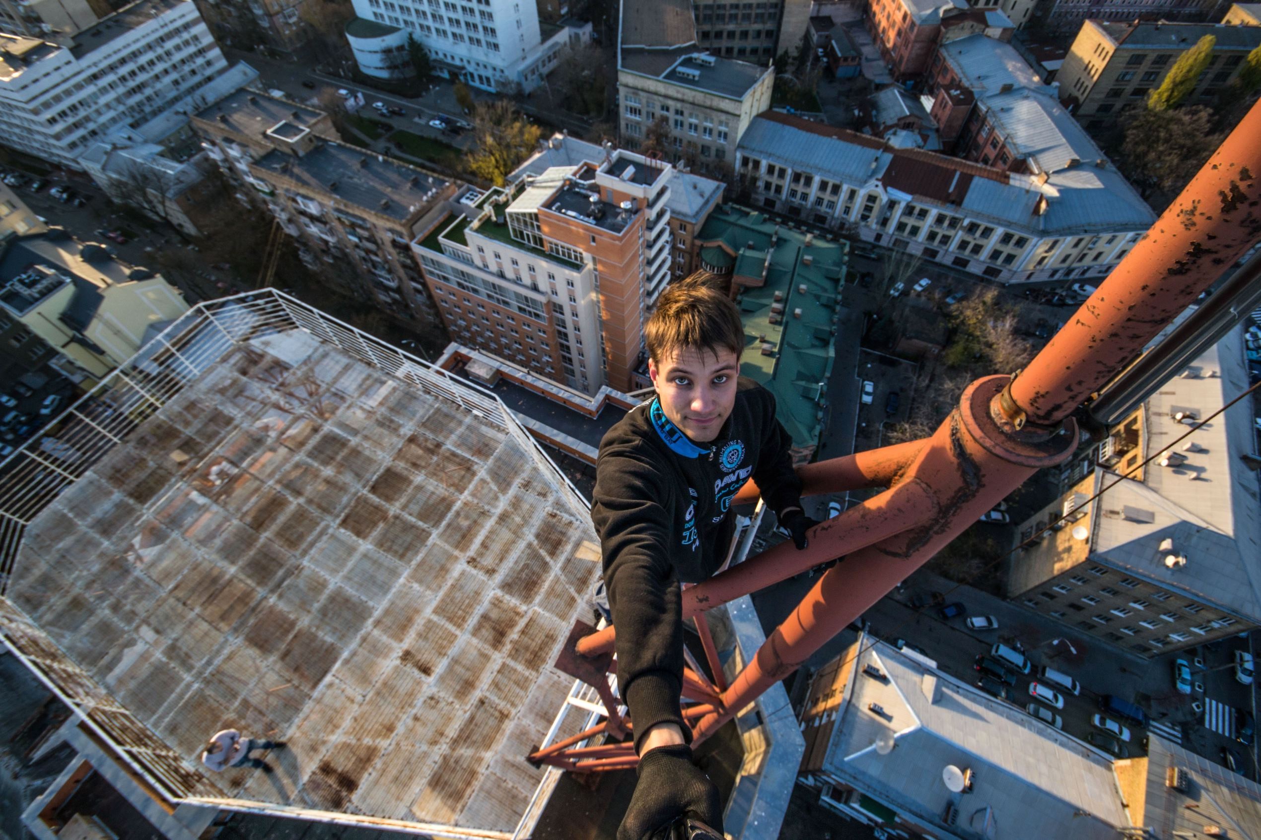 Yaroslav Segeda takes a selfie on top of tall building in Kiev, Ukraine in Aug. 2014.