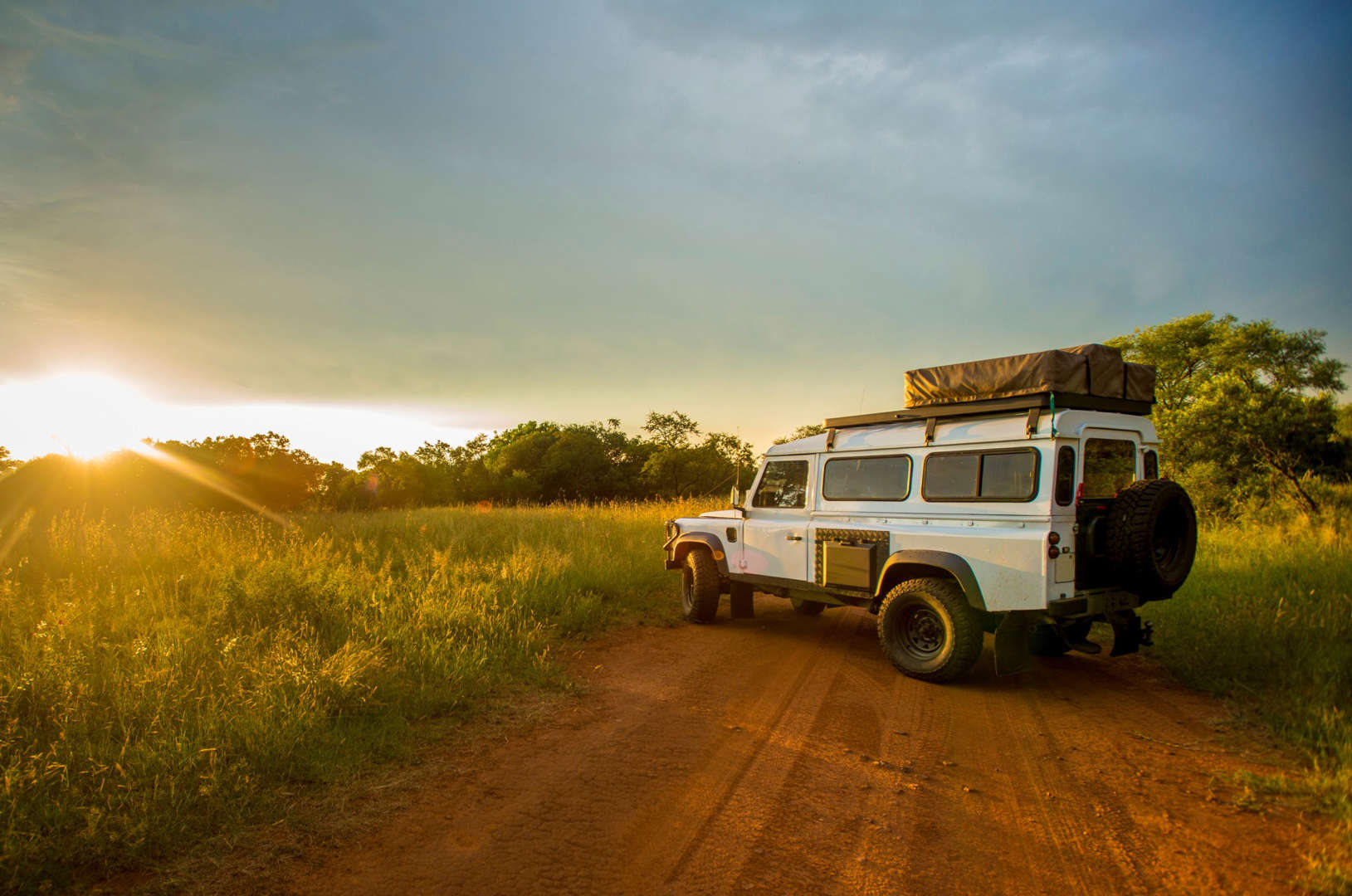 Safari car at sunset in South Africa.
