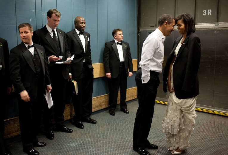 Slide 4 de 95: Jan. 20, 2009: “We were on a freight elevator headed to one of the Inaugural Balls. It was quite chilly, so the President removed his tuxedo jacket and put it over the shoulders of his wife. Then they had a semi-private moment as staff member and Secret Service agents tried not to look.”