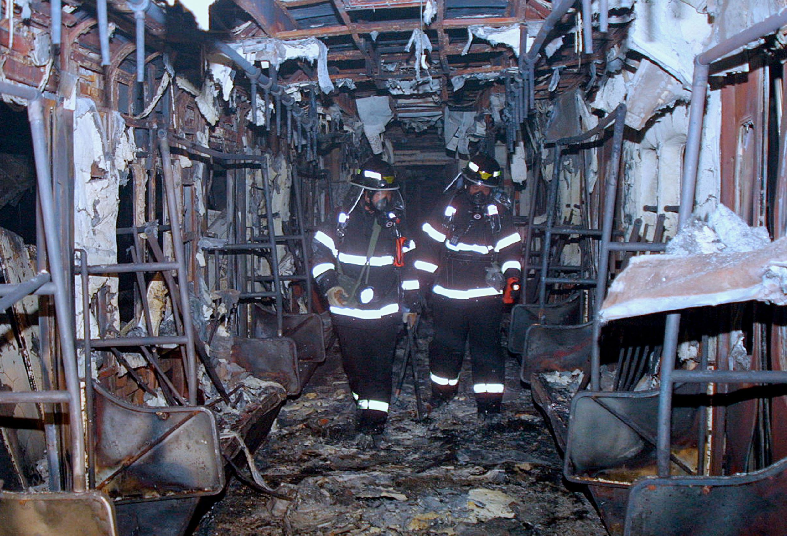 Slide 12 of 12: South Korean rescue workers inspect a subway train destroyed by a fire at a subway station February 18, 2003 in Daegu, 200 miles southeast of Seoul, South Korea. About 120 people were killed and at least 135 injured after a man ignited a milk carton filled with flammable material on a subway train in S. Korea's third largest city, officials said. Police are interrogating a 56-year-old man who was seen carrying a milk carton into the subway car, but no motive has been found.