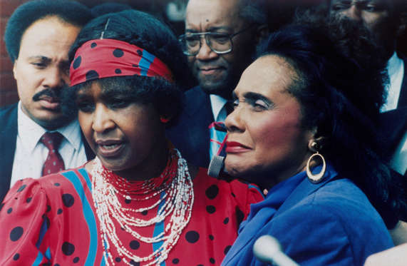 Slide 19 of 26: In this Sept. 11, 1986, file photo, Winnie Mandela, left, wife of jailed African National Congress leader Nelson Mandela is joined by Coretta Scott King, widow of American civil rights leader Dr Martin Luther King Jr., in Soweto.