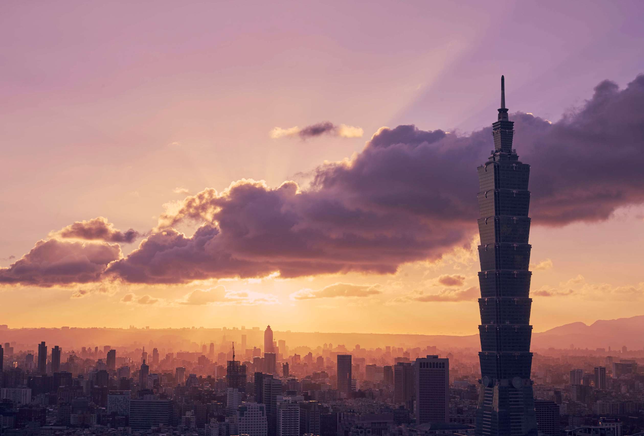 TAIPEI, TAIWAN - 2016/07/31: Taipei 101 dominates the view as the sun sets over the city.The Elephant Mountain hiking trail is the closest viewpoint to the iconic building and attracts photographers and tourists whenever there's a chance of a nice sunset.