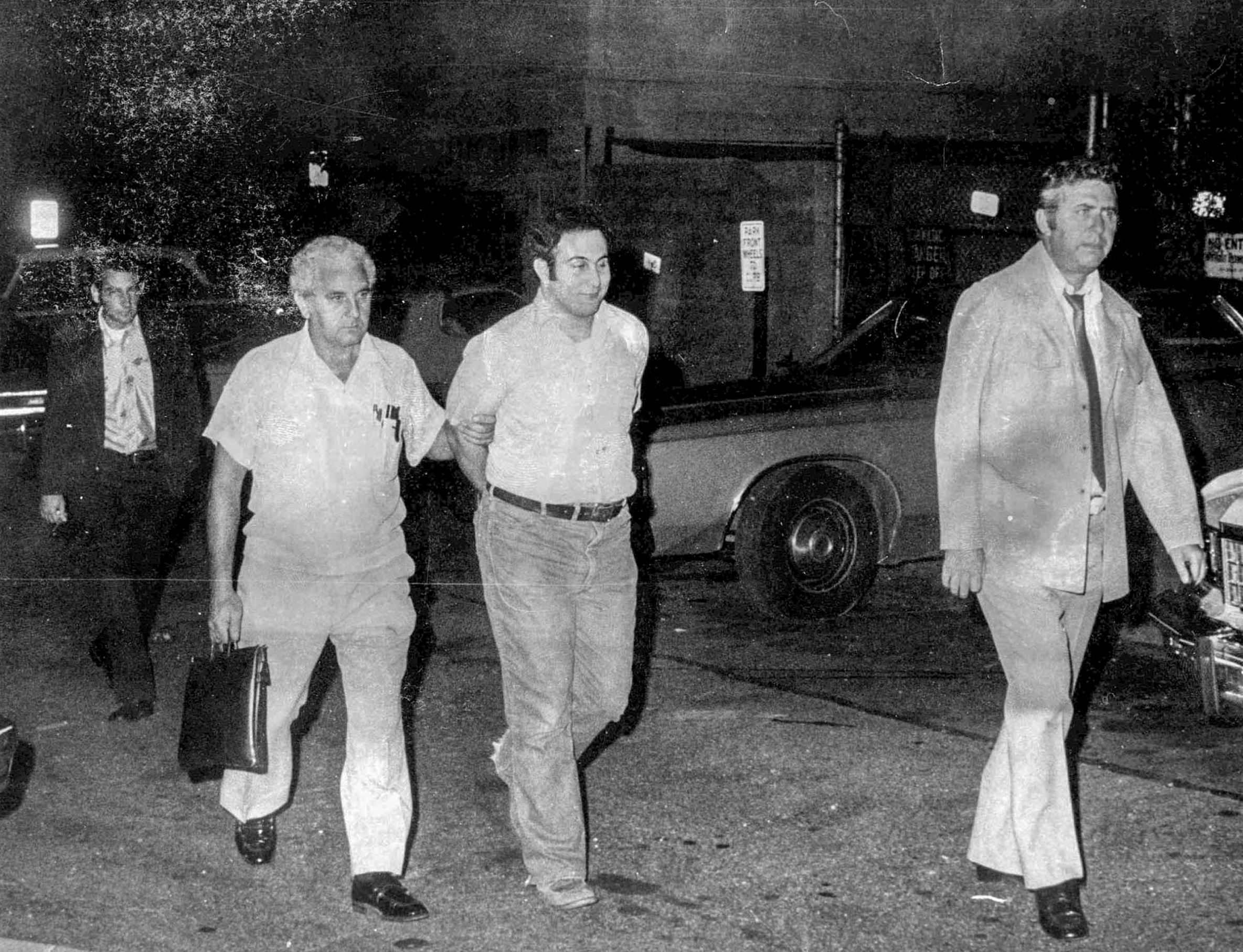 Slide 8 of 9: Image Caption: N 014455 002 8/11/77 Son Of Sam Killer - David Berkowitz - Arrested. (Photo By Tom Keller/Getty Images)