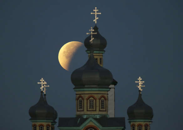 Slide 1 of 53: The Super Moon During a Lunar Eclipse in the Sky Above a Church in Turets Village Some 110 Km From Minsk Belarus 28 September 2015 the Combination of a Supermoon and Total Lunar Eclipse Last Occurred in 1982 and Will not Happen Again Until 2033 Belarus Turets