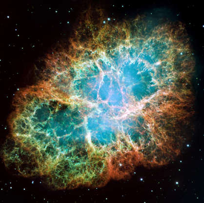 Slide 46 of 86: IN SPACE - DECEMBER 1: In this handout from NASA, the mosaic image, one of the largest ever taken by NASA's Hubble Space Telescope of the Crab Nebula, shows six-light-year-wide expanding remnant of a star's supernova explosion as released December 2, 2005. Japanese and Chinese astronomers witnessed this violent event nearly 1,000 years ago in 1054, together with, possibly, Native Americans. The orange filaments are the remains of the star and consist mostly of hydrogen. The rapidly spinning neutron star embedded in the center of the nebula is the dynamo powering the nebula's eerie interior bluish glow. The blue light comes from electrons whirling at nearly the speed of light around magnetic field lines from the neutron star. The neutron star, the crushed ultra-dense core of the exploded star, ejects twin beams of radiation that appear to pulse 30 times a second due to the neutron star's rotation. (Photo by NASA via Getty Images)