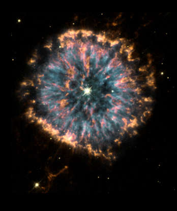 NGC 6751 - SSPL/Getty Images Slide 55 of 86: UNITED STATES - OCTOBER 29: Glowing in the constellation Aquila like a giant eye, the nebula NGC 6751, is a cloud of gas ejected several thousand years ago from the hot star visible in its centre. The hubble observations were obtained in 1998 with the Wide Field Planetary Camera 2 (WFPC2) by a team of astronomers led by Arsen Hajian of the US Naval Observatory in Washington DC. The nebula shows several remarkable and poorly understood features. Blue regions mark the hottest glowing gas, which forms a roughly circular ring around the central stellar remnant. Orange and red show the locations of cooler gas. (Photo by SSPL/Getty Images)