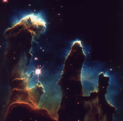 Slide 60 of 86: 1st April 1995: An image taken via Hubble telescope entitled Pillars of Creation, depicting gaseous pillars in M16, the Eagle Nebula. These columns of hydrogen and dust act as incubators for new stars. (Photo by Space Frontiers/Hulton Archive/Getty Images)