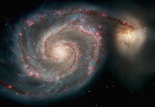 Slide 45 of 86: SPACE - APRIL 25: In this handout image released from the Hubble Space Telescope the Whirlpool Galaxy is seen , April 25, 2005 released for the Hubble 15th anniversary. Nasa's Space Telescope has obited the Earth for 15 years and has taken more than 700,000 images of the comos. This image is one of the sharpest images Hubble has ever produced, taken with the newest camera. (Photo by Hubble Space Telescope/Nasa via Getty Images)
