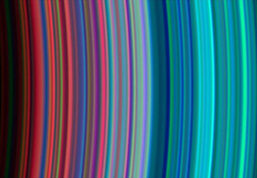 الشريحة 9 من 11: On July 1, 2004, NASA's Cassini spacecraft arrived at Saturn, marking the end of the spacecraft's nearly seven-year journey through the solar system as well as the beginning of its tour of Saturn, its rings, moons and magnetosphere.  This image, taken on June 30, 2004 during Cassini's orbital insertion at Saturn, shows, from left to right, the outer portion of the C ring and inner portion of the B ring. The B ring begins a little more than halfway across the image. The general pattern is from "dirty" particles indicated by red to cleaner ice particles shown in turquoise in the outer parts of the rings.  The ring system begins from the inside out with the D, C, B and A rings followed by the F, G and E rings.  This image was taken with the Ultraviolet Imaging Spectrograph instrument, which is capable of resolving the rings to show features up to 97 kilometers (60 miles) across, roughly 100 times the resolution of ultraviolet data obtained by the Voyager 2 spacecraft.  Image Credit: NASA/JPL/University of Colorado