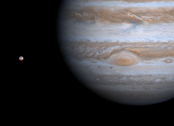 Jupiter and Io - JPL/University of Arizona/NASA Slide 54 of 86: The Cassini spacecraft captured Jupiter's Great Red Spot and the volcanic moon Io in this color composite image taken during its flyby of the giant planet in 2000. The picture is a color composite, with enhanced contrast, taken from a distance of 28.6 million km (17.8 million miles). It has a resolution of 170 km (106 miles) per pixel. Jupiter's closest large moon, Io, is visible at left. The edges of the Red Spot are cloudier with ammonia haze than the spot's center. The filamentary structure in the center appears to spiral outward toward the edge. NASA's Galileo spacecraft has previously observed the outer edges of the Red Spot to be rotating rapidly counterclockwise, while the inner portion was rotating weakly in the opposite direction. Whether the same is true now will be answered as Cassini gets closer to Jupiter and interior cloud features become sharper. Cassini will make its closest approach to Jupiter, at a distance of about 10 million kilometers (6 million miles), on Dec. 30, 2000. The Red Spot region has changed in one notable way over the years: In images from NASA's Voyager and Galileo spacecraft, the area surrounding the Red Spot is dark, indicating relatively cloud-free conditions. Now, some bright white ammonia clouds have filled in the clearings. This appears to be part of a general brightening of Jupiter's cloud features during the past two decades. Jupiter has four large moons and an array of tiny ones. In this picture, Io is visible. The white and reddish colors on Io's surface are due to the presence of different sulfurous materials while the black areas are due to silicate rocks. Like the other large moons, Io always keeps the same hemisphere facing Jupiter, called the sub-Jupiter hemisphere. The opposite side, much of which we see here, is the anti-Jupiter hemisphere. Io has more than 100 active volcanoes spewing very hot lava and giant plumes of gas and dust. Its biggest plume, Pele, is near the bottom left edge of Io's disk as seen here.
