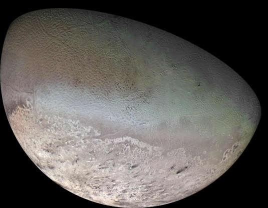 Slide 62 of 86: Neptune's largest moon Triton, is seen in this mosaic of images captured by Voyager 2 during the only visit thus far to the Neptune system.  Triton is one of only three objects in the Solar System known to have a nitrogen-dominated atmosphere (the others are Earth and Saturn's giant moon, Titan). It has the coldest surface known anywhere in the Solar System (38 K, about -391 degrees Fahrenheit) - so cold that most of Triton's nitrogen is condensed as frost, making it the only satellite in the Solar System known to have a surface made mainly of nitrogen ice.  The dark streaks overlying the pinkish ices at bottom are believed to be dust deposited from huge geyser-like plumes, some of which were found to be active during the Voyager 2 flyby. The bluish-green band visible in this image extends all the way around Triton near the equator; it may consist of relatively fresh nitrogen frost deposits. The greenish areas includes what is called the cantaloupe terrain, whose origin is unknown, and a set of "cryovolcanic" landscapes apparently produced by icy-cold liquids (now frozen) erupted from Triton's interior.