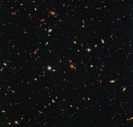 Slide 84 of 86: Peering deep into the early universe, this picturesque parallel field observation from the NASA/ESA Hubble Space Telescope reveals thousands of colorful galaxies swimming in the inky blackness of space. A few foreground stars from our own galaxy, the Milky Way, are also visible.  In October 2013 Hubble’s Wide Field Camera 3 (WFC3) and Advanced Camera for Surveys (ACS) began observing this portion of sky as part of the Frontier Fields program. This spectacular skyscape was captured during the study of the giant galaxy cluster Abell 2744, otherwise known as Pandora’s Box. While one of Hubble’s cameras concentrated on Abell 2744, the other camera viewed this adjacent patch of sky near to the cluster.  Containing countless galaxies of various ages, shapes and sizes, this parallel field observation is nearly as deep as the Hubble Ultra-Deep Field. In addition to showcasing the stunning beauty of the deep universe in incredible detail, this parallel field — when compared to other deep fields — will help astronomers understand how similar the universe looks in different directions.  Image credit: NASA, ESA and the HST Frontier Fields team (STScI), Acknowledgement: Judy Schmidt Text credit: European Space Agency