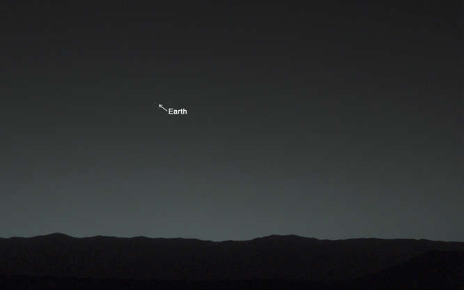 Earth from Mars - NASA Slide 74 of 86: A starry twilight sky looms over a nondescript Martian surface. If you had happened to be standing next to the Mars Curiosity rover as it took this picture, you would have seen Earth shining as a distinct “evening star.”