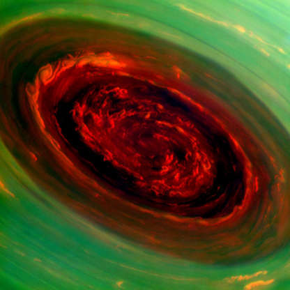 Slide 37 of 86: IN SPACE - NOVEMBER 27, 2012: In this handout image released on April 30, 2013 by NASA, the spinning vortex of Saturn's north polar storm is seen from NASA's Cassini spacecraft on November 27, 2012 in the Saturnian system of space. The false-color image of the storm resembles a red rose surrounded by green foliage which was made by using a combination of spectral filters sensitive to wavelengths of near-infrared light at a distance of approximately 261,000 miles from Saturn. (Photo by NASA via Getty Images)