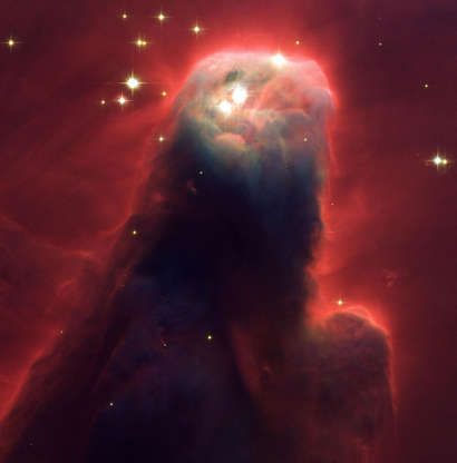 Cone Nebula - NASA/WireImage/Getty Images Slide 49 of 86: Resembling a nightmarish beast rearing its head from a crimson sea, this monstrous object is actually an innocuous pillar of gas and dust. Called the Cone Nebula (NGC 2264) ? so named because, in ground-based images, it has a conical shape ? this giant pillar resides in a turbulent star-forming region. This picture, taken by the newly installed Advanced Camera for Surveys (ACS) aboard NASA's Hubble Space Telescope, shows the upper 2.5 light-years of the nebula, a height that equals 23 million roundtrips to the Moon. The entire nebula is 7 light-years long. The Cone Nebula resides 2,500 light-years away in the constellation Monoceros (Photo by NASA/WireImage) *** Local Caption ***