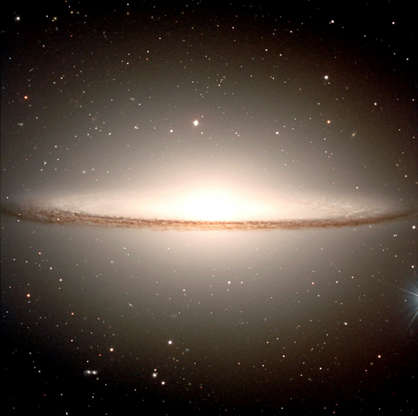 Slide 53 of 86: F365237 01: Billions of old stars cause the diffuse glow of the extended central bulge in the Sombrero Galaxy, in this photo taken February 22, 2000. Even with a small telescope pointed toward the constellation of Virgo, light that is 50 million years old can be seen emanating from the distant galaxy. The very center of the Sombrero glows across the electromagnetic spectrum, and is thought to house a large black hole. (Courtesy of NASA)