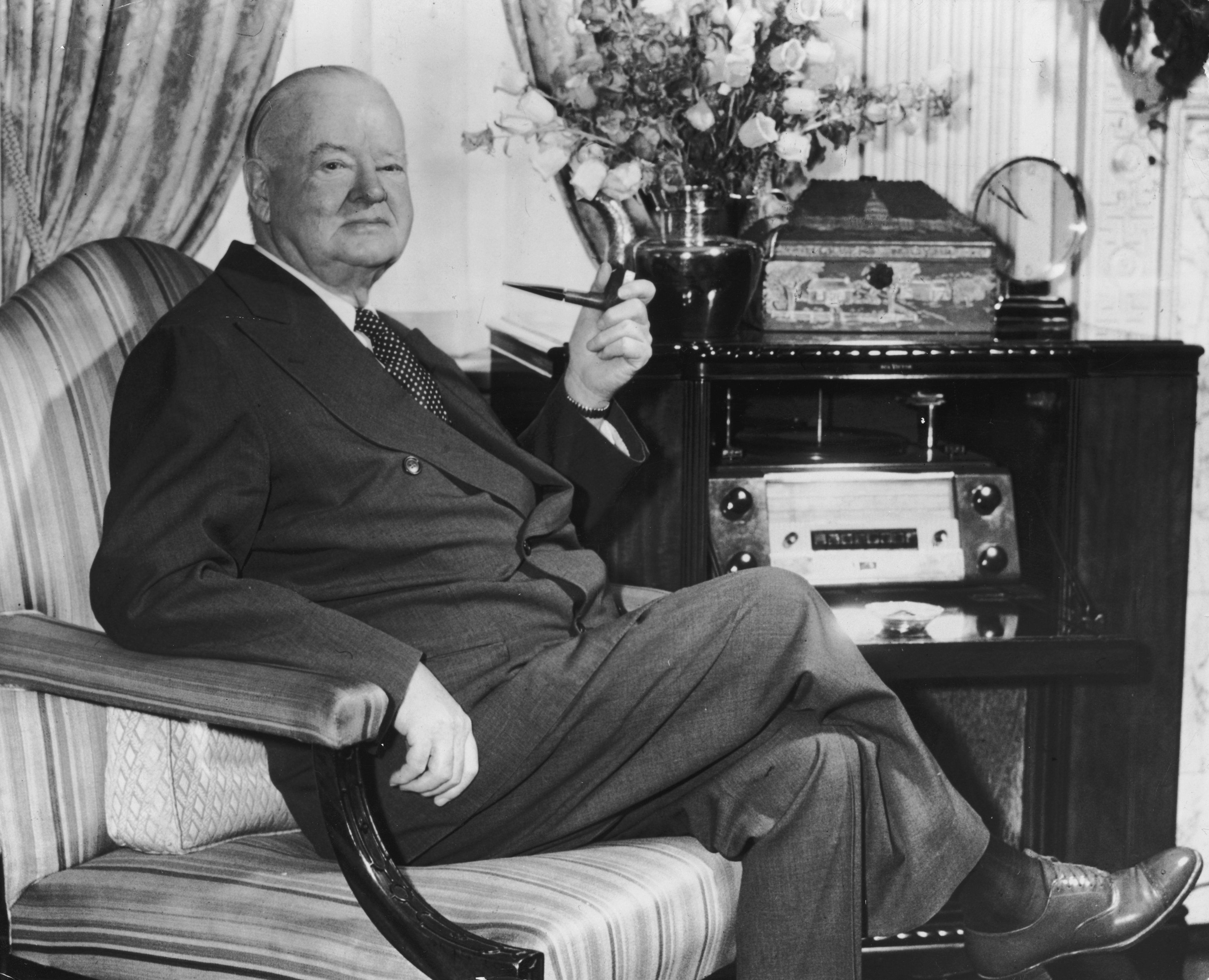 Slide 4 of 9: Image Caption: circa 1962:  Portrait of former American president Herbert Hoover (1874 - 1964) seated in an armchair with a pipe in his suite at the Waldorf Towers, New York City.  (Photo by Hulton Archive/Getty Images)