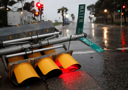 Hurricane Harvey - Adrees Latif/Reuters Slide 4 of 37: Traffic lights lie on a street after being knocked down, as Hurricane Harvey approaches in Corpus Christi, Texas, U.S. August 25, 2017.