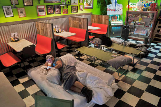 Hurricane Harvey - Jabin Botsford/The Washington Post/Getty Images Slide 3 of 37: PORT LAVACA, TX - AUGUST 25: Jack Rigby, 17, lays on a mattress as he along with is family and friends prepare to ride out the storm at the Green Iguana Grill as Hurricane Harvey intensifies in the Gulf of Mexico in Port Lavaca, TX on Friday, Aug 25, 2017.