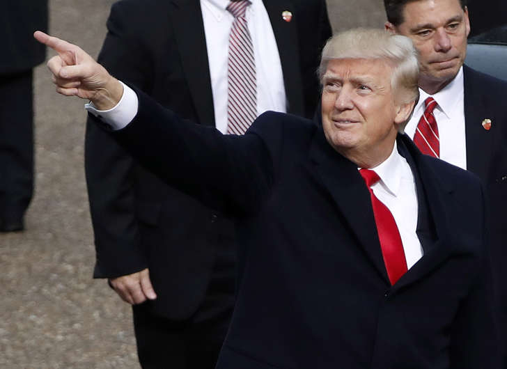 President Donald Trump points during the 58th Presidential Inauguration parade for President Donald Trump in Washington.