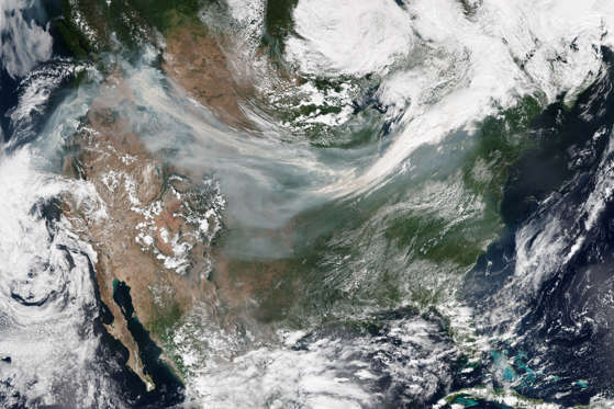 Slide 1 of 27: With dozens of wildfires burning across the western United States and Canada, many North Americans have had the acrid taste of smoke in their mouths during the past few weeks. On September 5, 2017, the National Interagency Fire Center (NIFC) reported more than 80 large fires burning in nine western U.S. states. People living in large stretches of northern California, Oregon, Washington, and Idaho have been breathing what the U.S. government’s Air Now website rated as “hazardous” air. The natural-color mosaic above was made from several scenes acquired on September 4, 2017, by the Visible Infrared Imaging Radiometer Suite (VIIRS) on the Suomi National Polar-orbiting Partnership (Suomi-NPP) satellite. The Ozone Mapper Profiler Suite (OMPS) on Suomi NPP also collected data on airborne aerosols as they were swept by winds from west to east across the continental United States (second image). The OMPS map depicts relative aerosol concentrations, with lower concentrations appearing in yellow and higher concentrations appearing in dark orange-brown. Note that the sensor detects aerosols in high-altitude plumes more readily than lower plumes, so this map does not reflect air quality conditions at “nose height.” Rather it shows where large plumes of smoke were lofted several kilometers up into the atmosphere. On September 5, roughly 7.8 million acres had burned in the United States since the beginning of 2017, according to NIFC. “While it is unlikely that this season will be record-breaking for modern fire record keeping in the western United States, it is above normal relative to the last decade—which has seen abundant fire activity,” said John Abatzoglou, a fire researcher at the University of Idaho. Unusually warm and dry conditions across a broad swath of the West has fueled the active fire season, noted Abatzoglou. A wet winter in some parts of the West also contributed by triggering the growth of more grass in the spring—grass that turns into fuel for fires in the summer. References AirNow (2017, September 4) September 4, 2017. Accessed September 5, 2017. NASA OMPS blog (2017, September 5) Fire (and Smoke) Situation Worsens Over US. Accessed September 5, 2017. National Interagency Fire Center (2017, September 5) National Fire News. Accessed September 5, 2017. NASA Earth Observatory images by Joshua Stevens and Jesse Allen, using Suomi NPP OMPS data provided courtesy of Colin Seftor (SSAI) and VIIRS data from the Suomi National Polar-orbiting Partnership. Story by Adam Voiland.