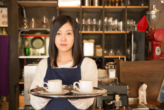 21 枚のスライドの 2 枚目: Young Pretty Waitress is serving coffee at the Japanese cafe restrant in Tokyo
