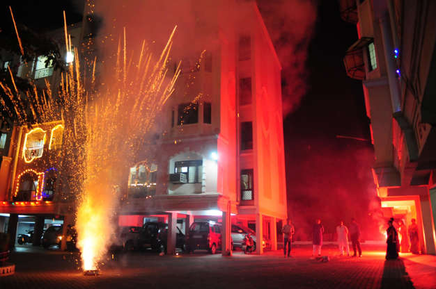 Slide 2 of 11: BHOPAL, INDIA - NOVEMBER 11: People celebrate as they burst crackers on the occasion of Diwali, the festival of Lights, on November 11, 2015 in Bhopal, India. Diwali is an ancient Hindu festival celebrated in autumn (northern hemisphere) or spring (southern hemisphere) every year. Diwali is one of the largest and brightest festivals in India. The festival spiritually signifies the victory of light over darkness, knowledge over ignorance, good over evil, and hope over despair. Its celebration includes millions of lights shining on housetops, outside doors and windows, around temples and other buildings in the communities and countries where it is observed. Pollution level during Diwali night was higher than average due to bursting of firecrackers. (Photo by Mujeeb Faruqui/Hindustan Times via Getty Images)