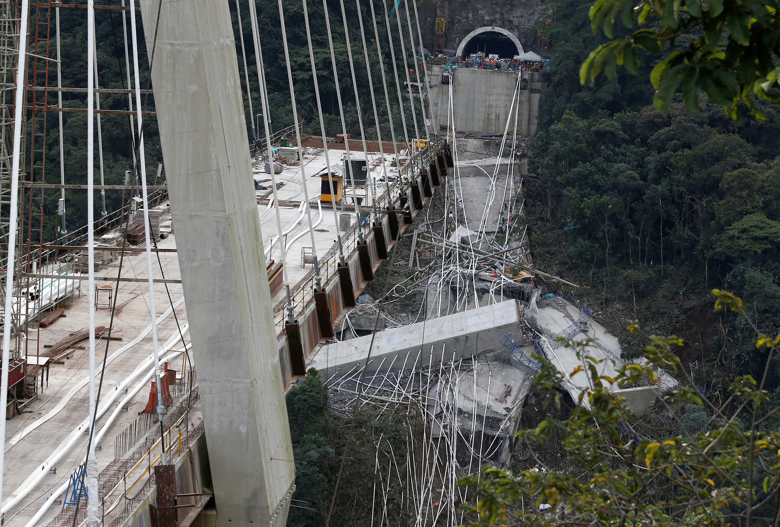 Slide 1 of 5: View of a bridge under construction that collapsed leaving dead and injured workers in Chirajara near Bogota, Colombia January 15, 2018.
