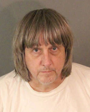 Slide 3 of 8: In this handout provided by the Riverside County Sheriffs Department, David Allen Turpin poses for a mugshot after being arrested when 13 siblings were found being held captive in his Perris, California home, at the Robert Presley Detention Center on January 14, 2018 in Riverside, California.