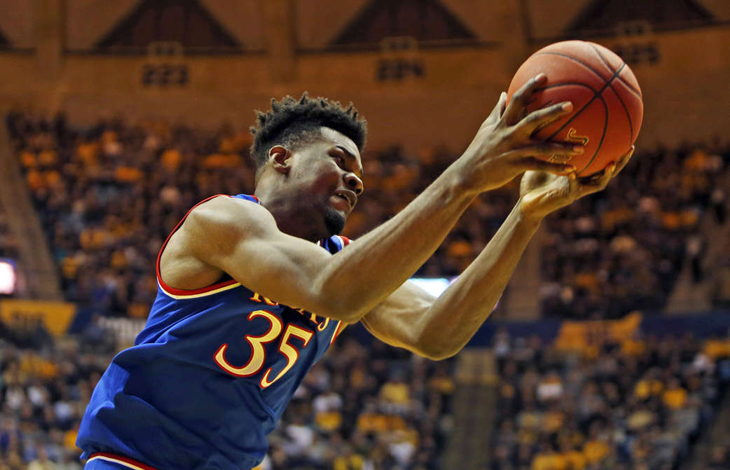 Slide 1 of 15: MORGANTOWN, WV - JANUARY 15:  Udoka Azubuike #35 of the Kansas Jayhawks pulls down a rebound against the West Virginia Mountaineers at the WVU Coliseum on January 15, 2018 in Morgantown, West Virginia.