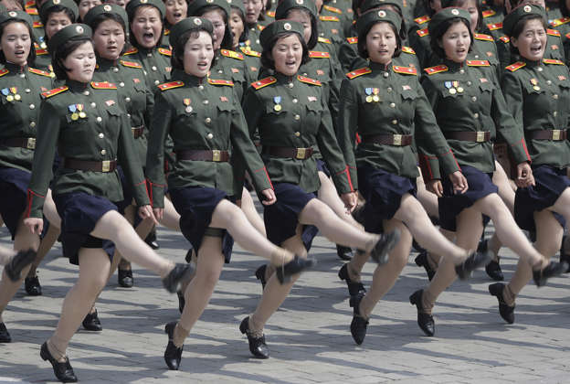 Women soldiers march across Kim Il Sung Square during a military parade