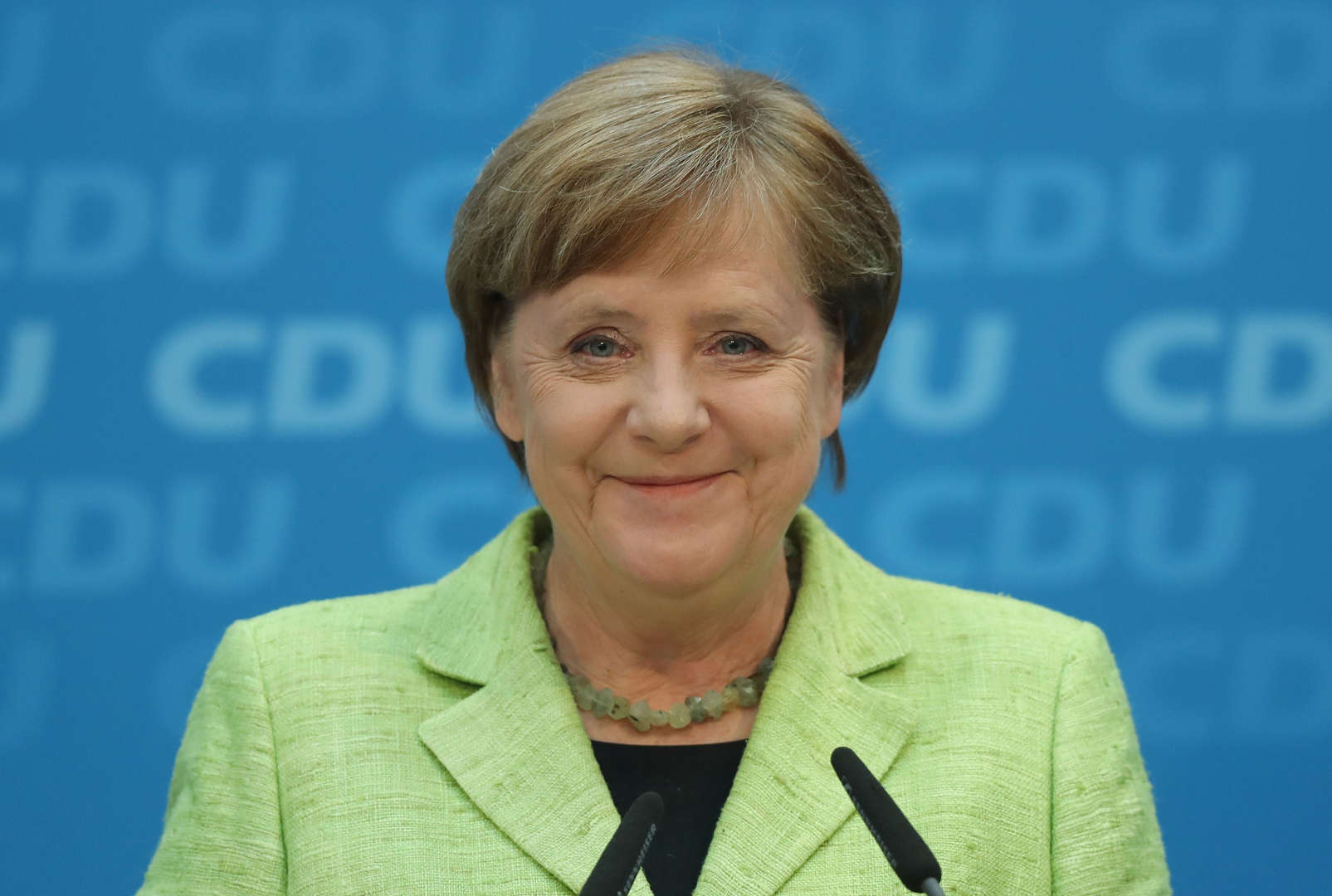 Διαφάνεια 31 από 36: German Chancellor and Chairwoman of the German Christian Democrats (CDU) Angela Merkel smiles while speaking to the media at CDU headquarters the day after state elections in Saarland gave the CDU a clear victory on March 27, 2017 in Berlin, Germany.