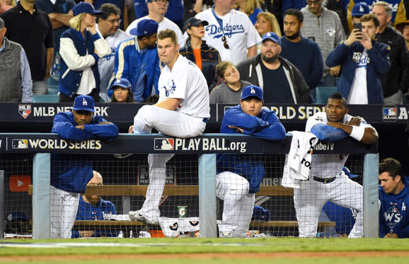 Slide 4 of 61: Los Angeles Dodgers players react from the dugout in the 9th inning against the Houston Astros in game seven of the 2017 World Series at Dodger Stadium.