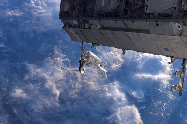 Slide 8 of 81: NASA astronaut Robert Curbeam works on the International Space Station's S1 truss during the space shuttle Discovery's STS-116 mission in Dec. 2006. European Space Agency astronaut Christer Fuglesang (out of frame) was his partner in the 6-hour, 36-minute spacewalk.