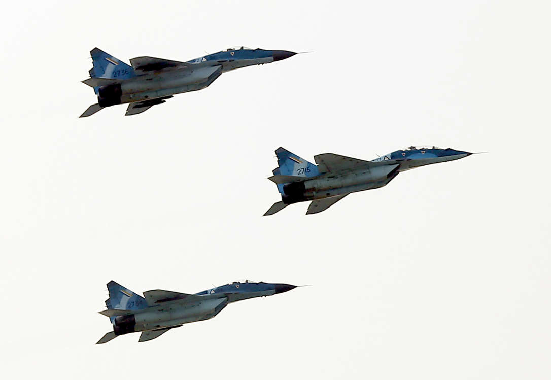 Slide 17 of 51: Russian MIG-29 fighter jets of the Myanmar Air Force fly in formation during a military parade in Naypyidaw on March 27, 2018 to mark the 73rd Armed Forces Day. / AFP PHOTO / Thet AUNG (Photo credit should read THET AUNG/AFP/Getty Images)
