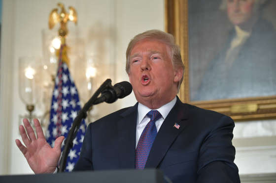 Slide 4 of 40: US President Donald Trump addresses the nation on the situation in Syria April 13, 2018 at the White House in Washington, DC. Trump said strikes on Syria are under way.  / AFP PHOTO / Mandel NGAN        (Photo credit should read MANDEL NGAN/AFP/Getty Images)