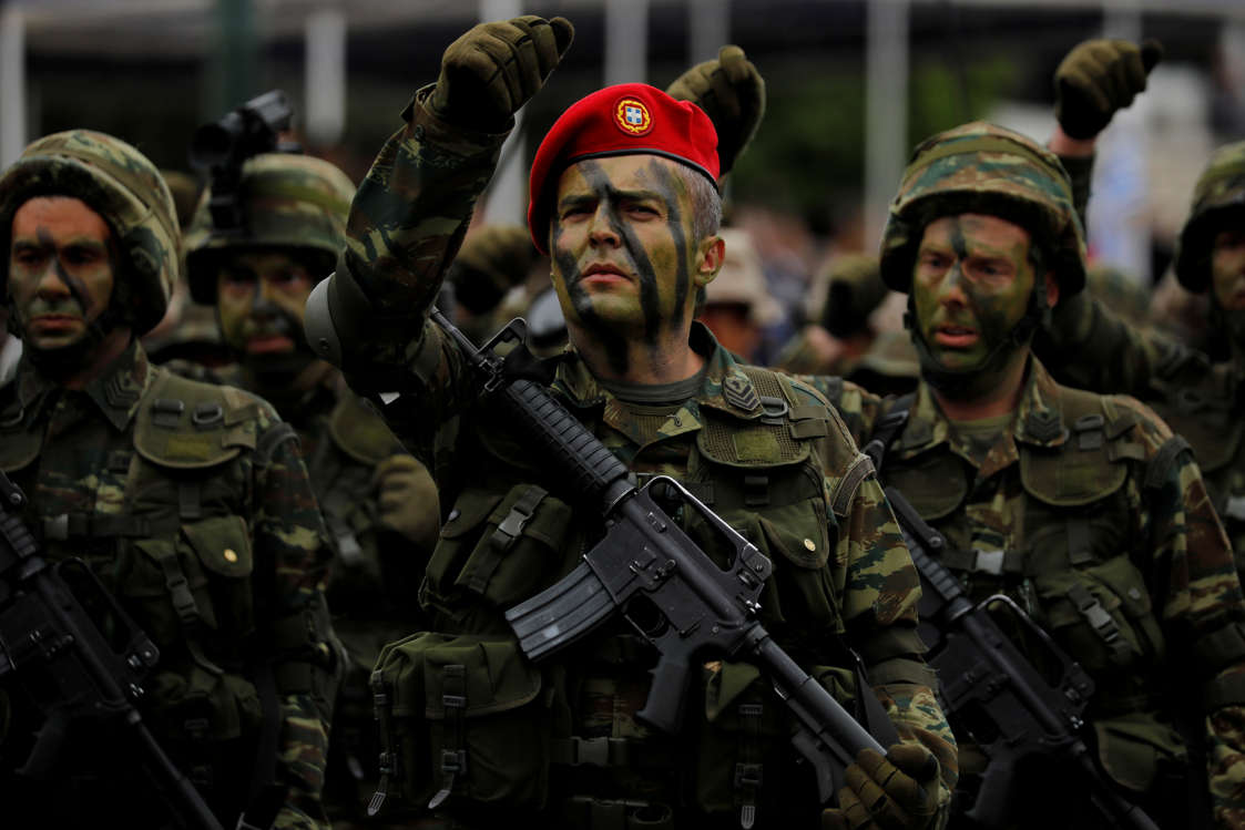 Slide 22 of 51: Hellenic Army Special Forces march during a military parade marking Greece's Independence Day in front of the parliament building in Athens, Greece, March 25, 2018. REUTERS/Alkis Konstantinidis TPX IMAGES OF THE DAY