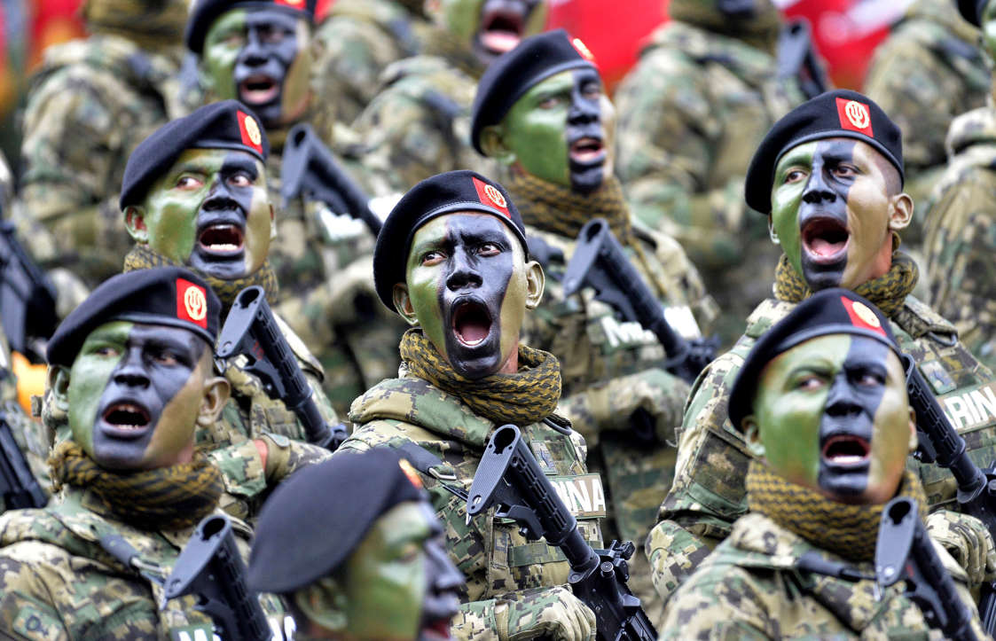 Slide 18 of 51: TOPSHOT - Mexican Navy special forces march during the parade celebrating a new anniversary of the country's independence, at Zocalo Square in Mexico City on September 16, 2016. / AFP / Pedro Pardo (Photo credit should read PEDRO PARDO/AFP/Getty Images)